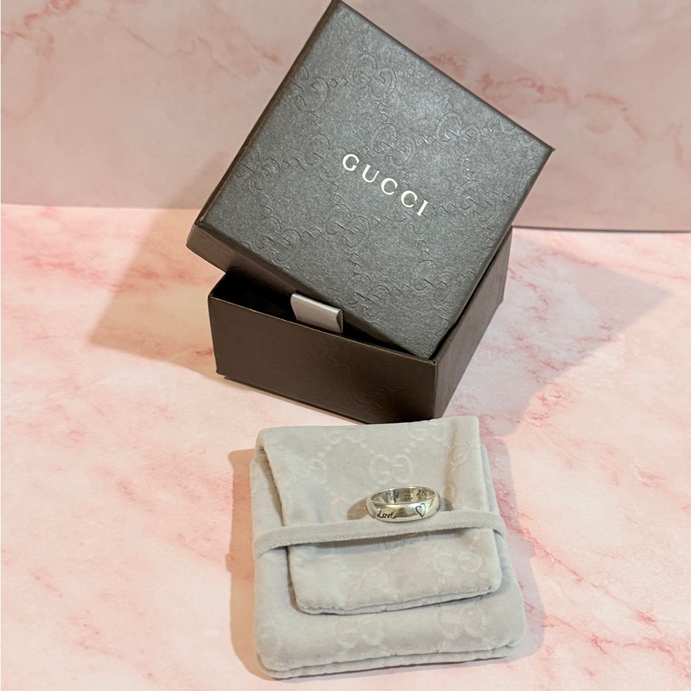 Gucci Silver Band Rings with Engraved Designs